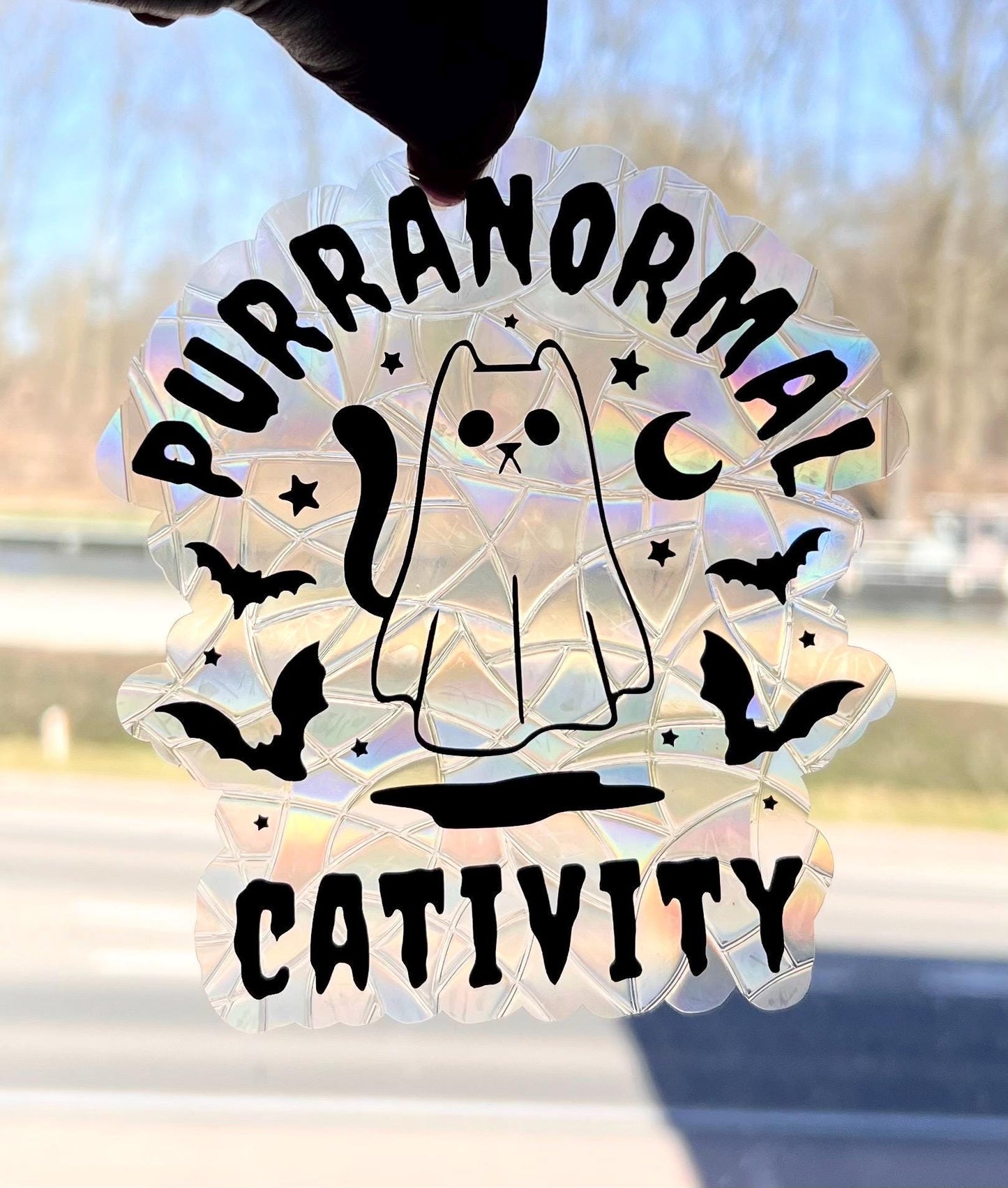 Purranormal cativity suncatcher statisch sticker. Regenboog sticker.